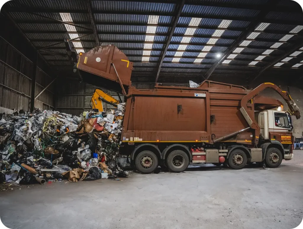 A large truck parked inside a spacious warehouse
